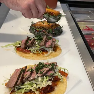 Top Sirloin Tacos on a Fuego Tortilla with Greens &amp; Truffle Aioli