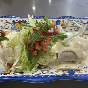 El Panzon - Large Burrito seared and topped with Warm Queso!