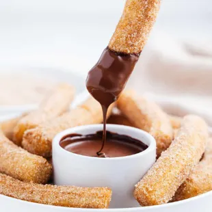 Made to Order Churro Sticks served with Warm Chocolate-Hazelnut Sauce.