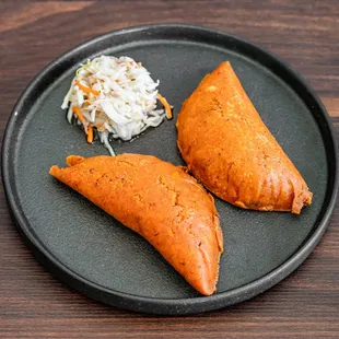 Pastelitos  Salvadorian style empanadas with an achiote masa, filled with ground beef, carrots and potatoes, green beens
