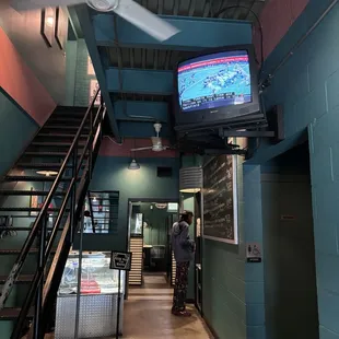Entryway, featuring old school CRT TVs