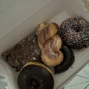 Apple fritter, chocolate sprinkle, chocolate glazed, chocolate frosted and cinnamon twist