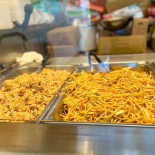 three pans of food in a buffet
