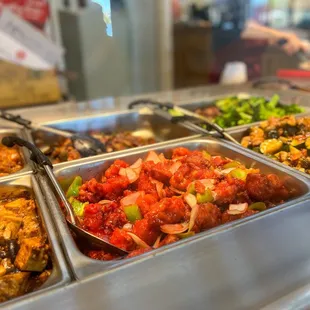 a variety of food in a buffet