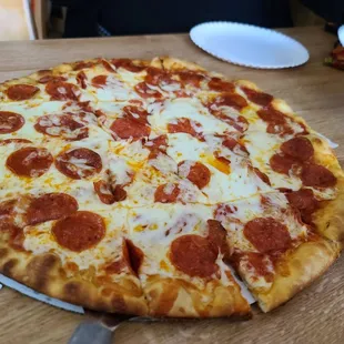 An absolutely delicious pepperoni and extra cheese pizza.
