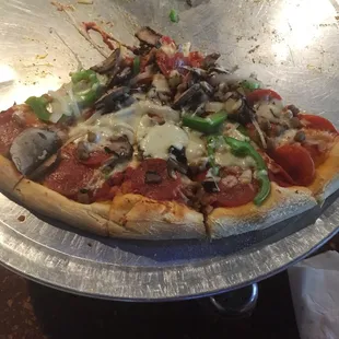 Pizza; pepperoni, sausage, mushrooms and green peppers.