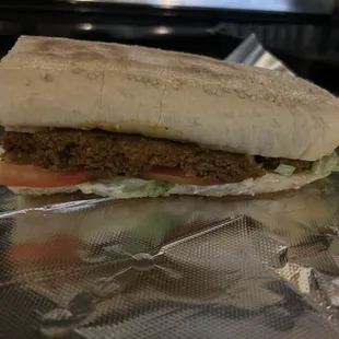 Half of a hot sausage on french bread