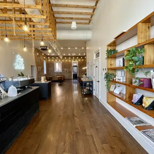a coffee shop with wooden shelves