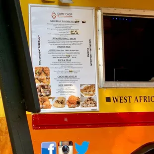a food truck with a menu on the side