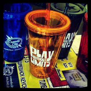 a plastic cup with a straw and a plastic cup with a straw and a plastic cup with a straw with a straw