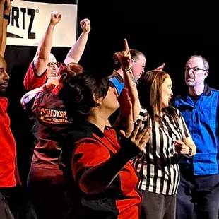 Two teams battle it out in improv comedy based on your suggestions. Fast paced and funny!