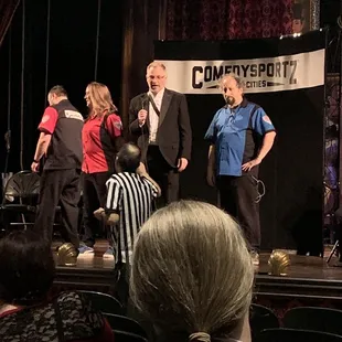 a group of people on stage