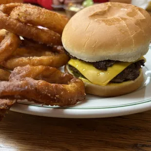 a hamburger and onion rings