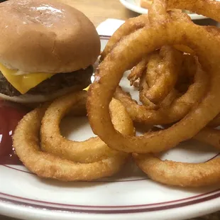 a hamburger and onion rings