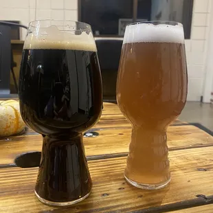two glasses of beer on a table