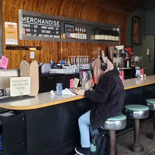 a man sitting at the counter