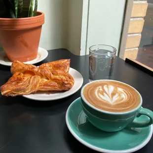 Cappuccino, apricot croissant and a sparkling water.