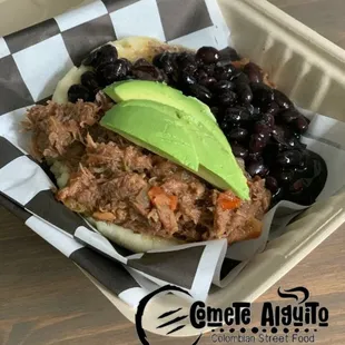 Arepa with beef, avocado and beans.