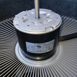 New oem condenser fan motor getting installed just before the blade gets reinstalled