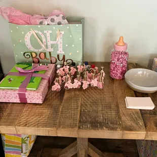 a wooden table with a baby's first birthday gift