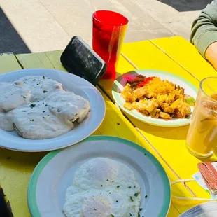 Loaded potatoes, biscuits and gravy, and over medium eggs!