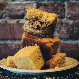 a stack of brownies on a plate