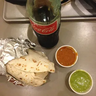 Burrito al pastor (pork). Delicious sauces (esp. Guacatillo). Glass bottle Coke.