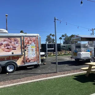 a food truck and picnic table