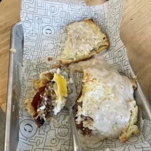 Half eaten smothered chicken biscuit : AMAZING