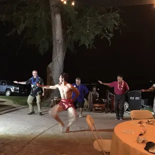 Hawaiian dancing, the dancers knees are moving so quickly they are a blur. Delta Sculling Center Appreciation Dinner.