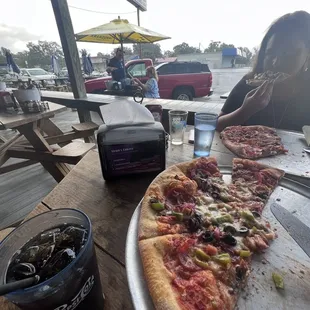 a pizza and a drink on a table