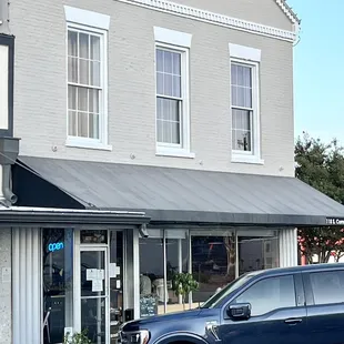 a car parked in front of a building