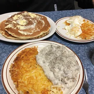 Half biscuits and gravy with hash. Hubs having cakes, eggs, browns and sausage.