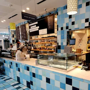 a blue and white tiled restaurant counter