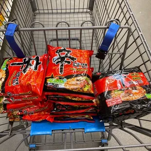 a shopping cart full of snacks
