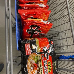 a shopping cart full of snacks