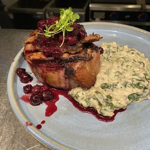Frenched Pork Chop topped w/ boudin and Housemade blueberry sauce/ Spinach Florentine