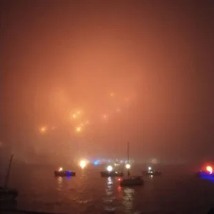 Foggy fireworks and lots of boats.