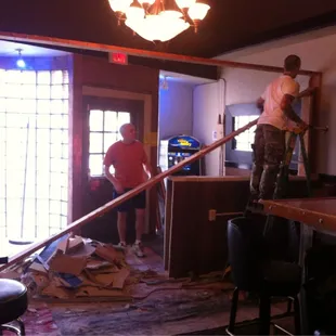 two men working on the bar