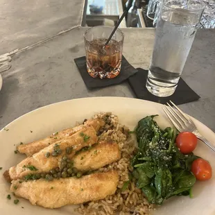 Hazelnut encrusted lake perch, wild rice pilaf, and spinach with a mezcal old fashioned