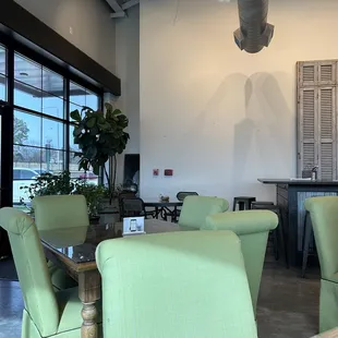 green chairs and tables