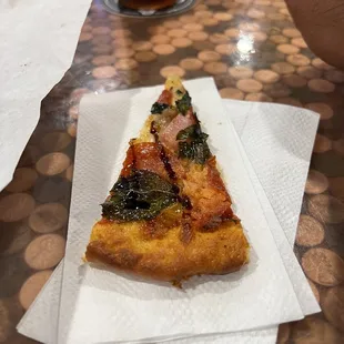 Complimentary sample of pizza from the kitchen
