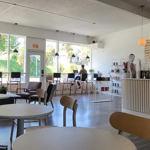 a coffee shop with tables and chairs