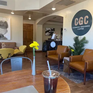 a coffee shop with a laptop on a table