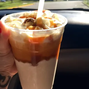 a hand holding a cup of coffee