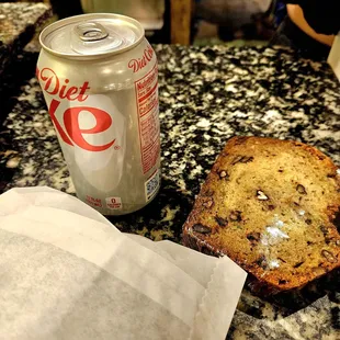 a soda and a loaf of bread