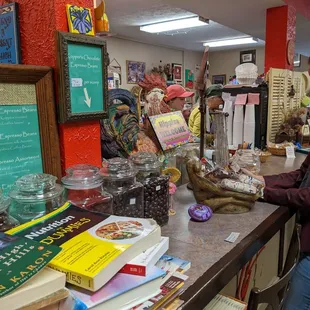 a woman standing at a counter in a store