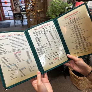 a person holding a menu