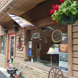 The entrance is down the alley next to Big Woods Pizza