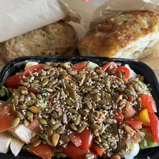Green fusilli pasta salad with chicken. Beautiful focaccia and a salted chocolate chip cookie.